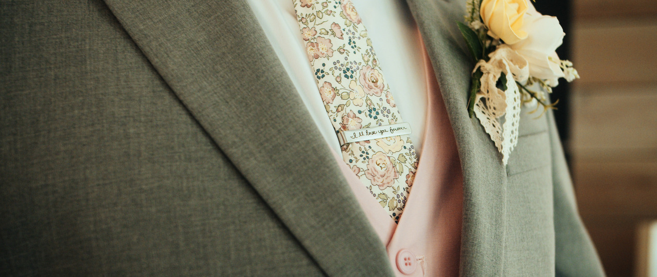 Closeup of Groom suit with boutonniere.