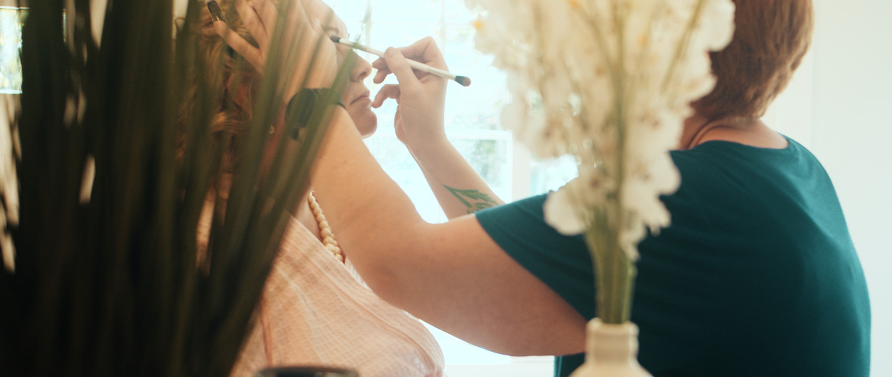Bride getting makeup done.