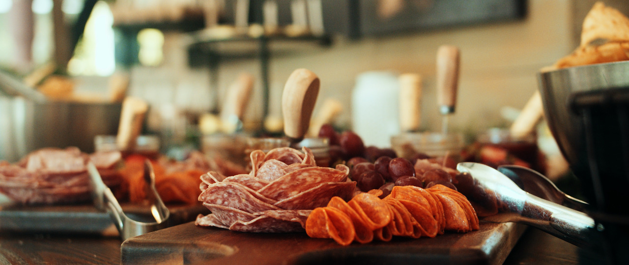 Snack table with deli meats.