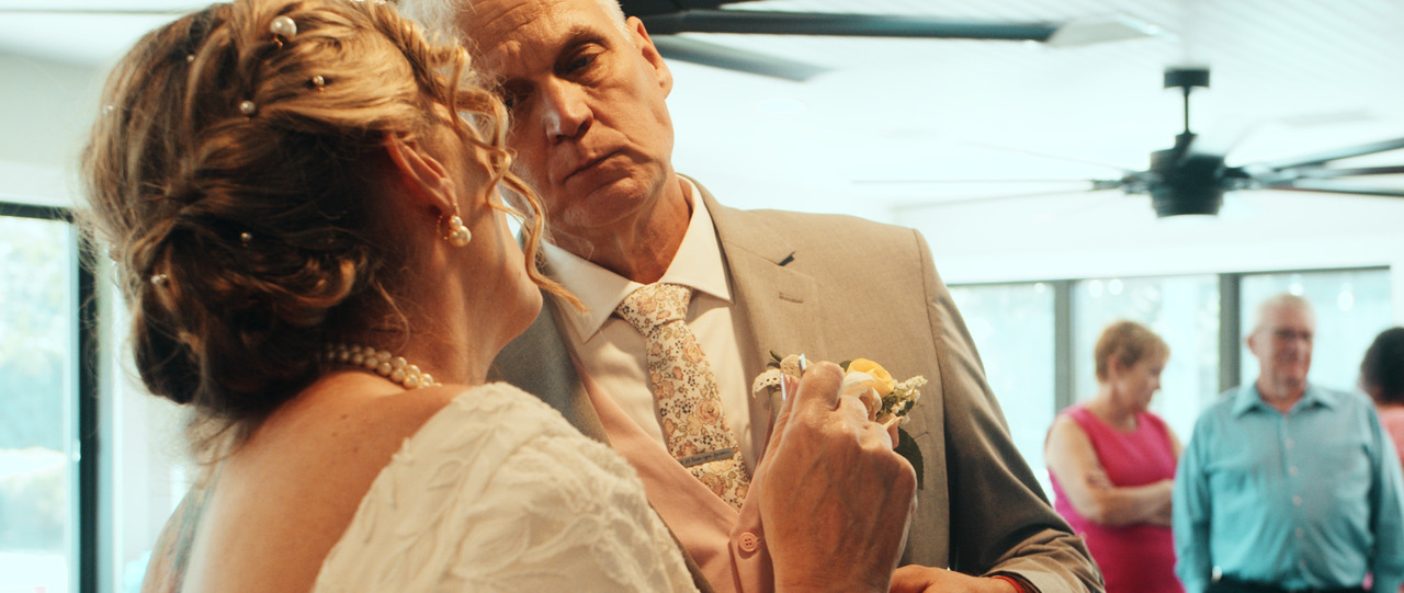 Bride and groom taste the cake.