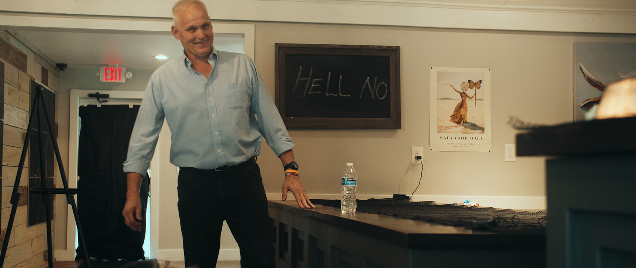 Groom standing, messing around during interview.