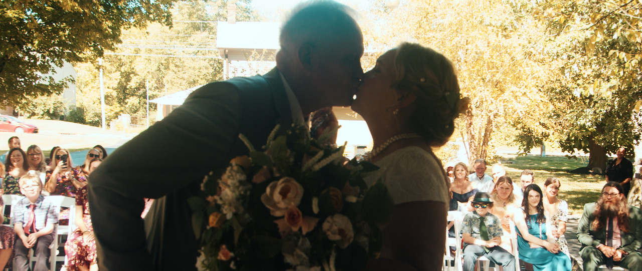 Bride and groom kissing on the wedding altar.