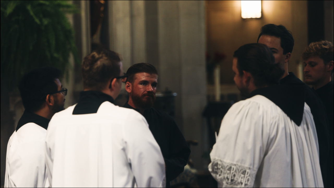 Altar servers conversing amongst themselves.