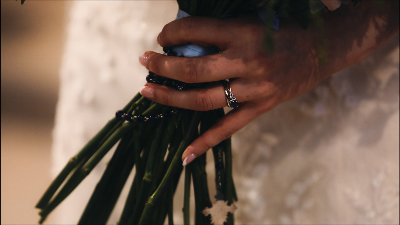 Closeup of bridal bouquet and wedding ring.