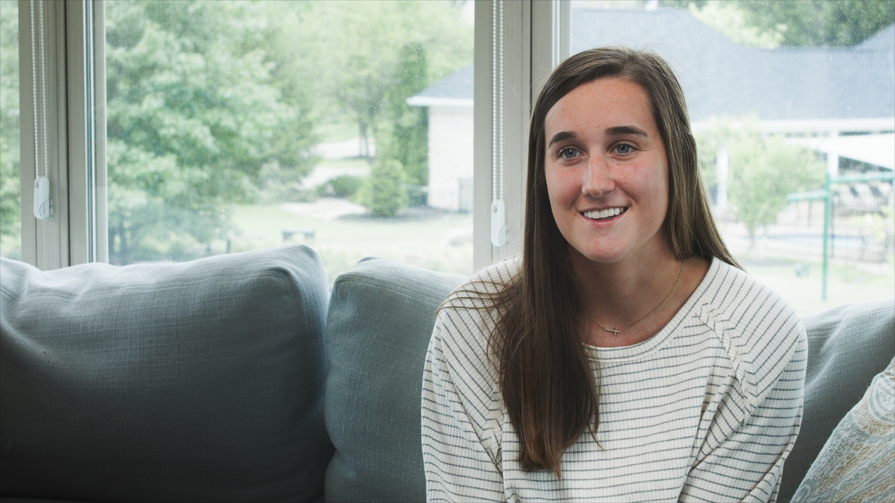Bride sitting, being interviewed.