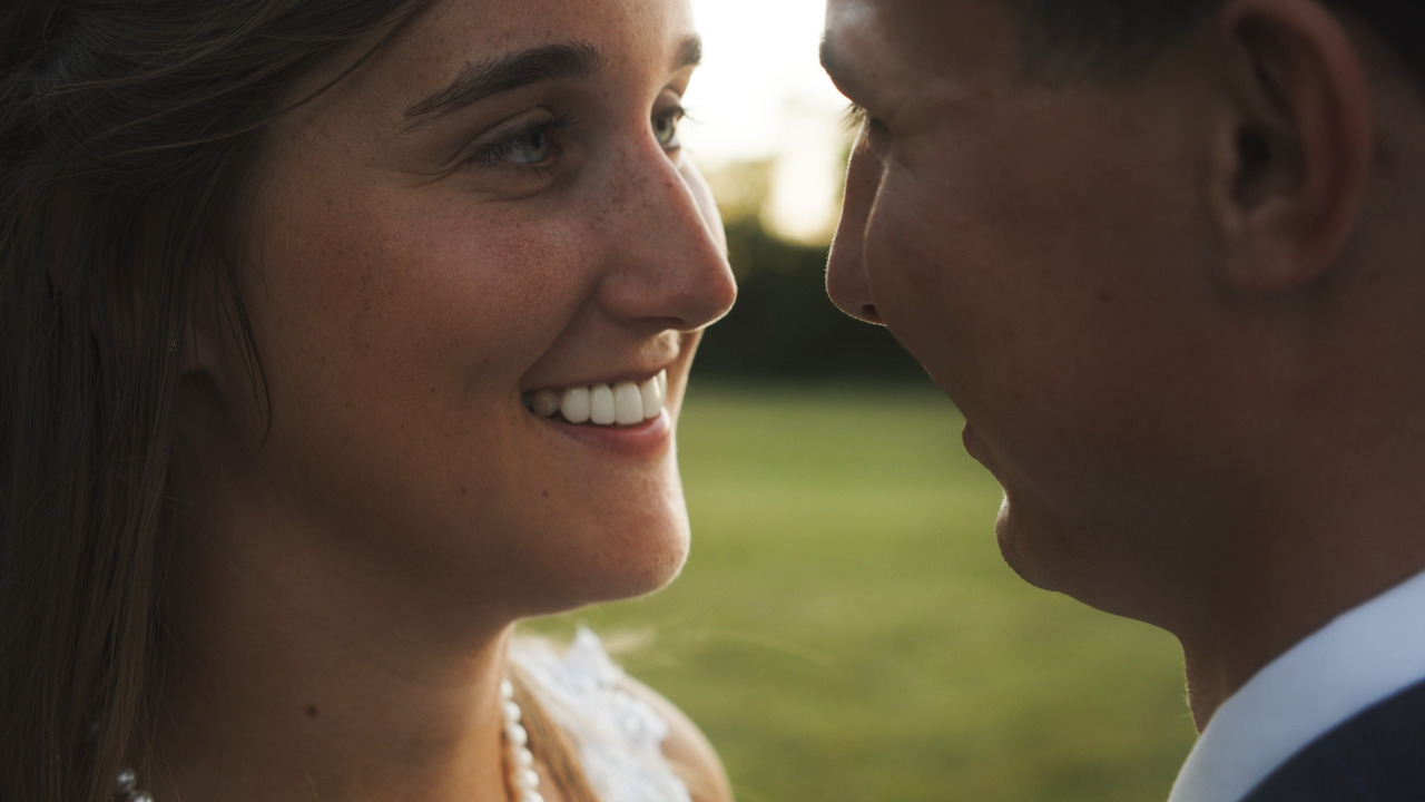 Bride and groom look deep into each other's eyes.