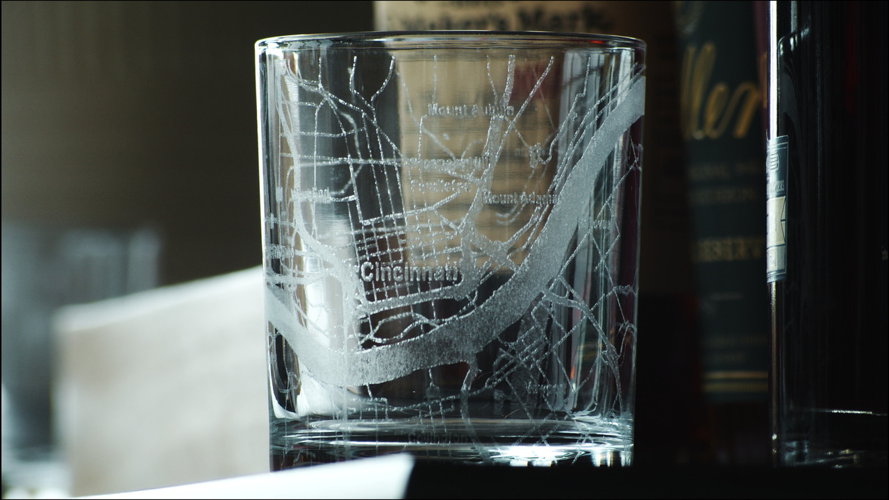 Glass tumbler with map of Cincinnati etched into it.