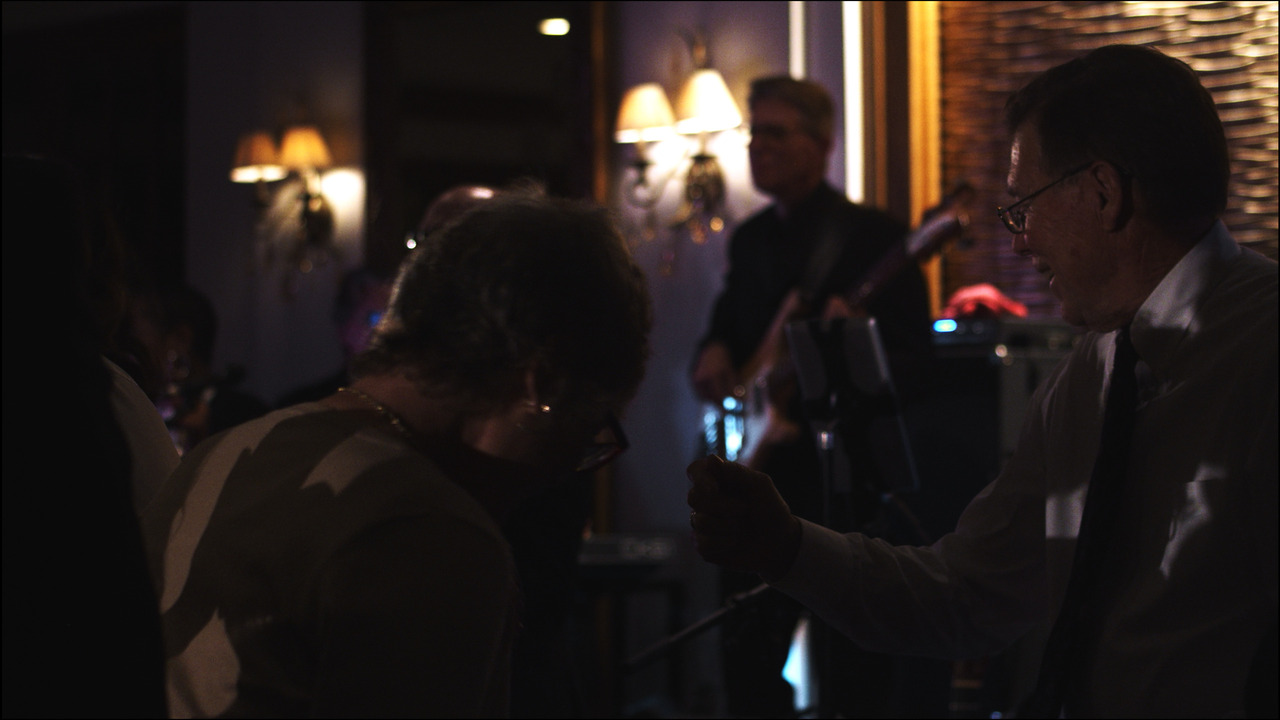 Elderly guests dancing.