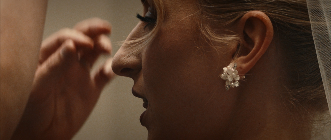 Closeup of bride getting final touches of makeup applied.