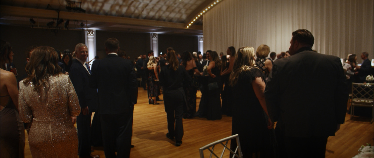 Cocktail hour guests standing and chatting.