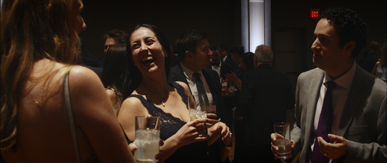 Guests conversing and laughing.