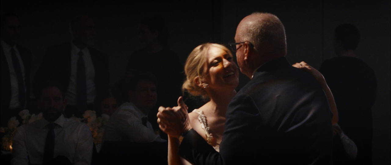 Bride dancing with father.