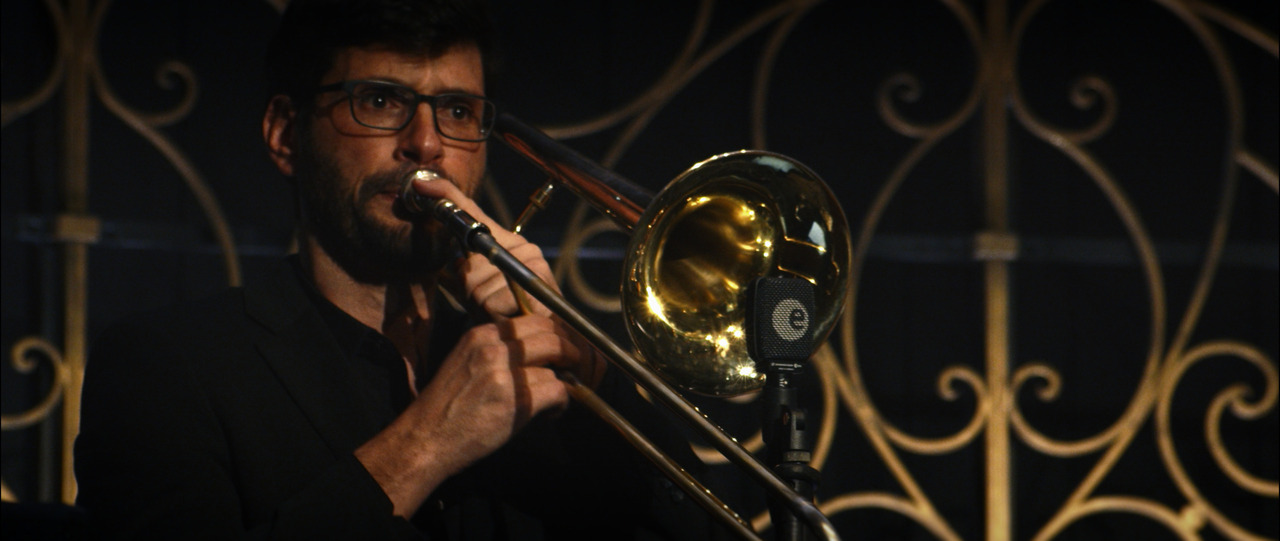 Trombone player performing.