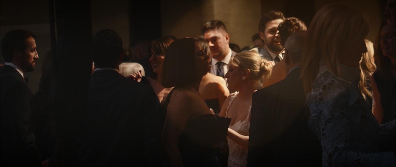Bride dancing with guests.