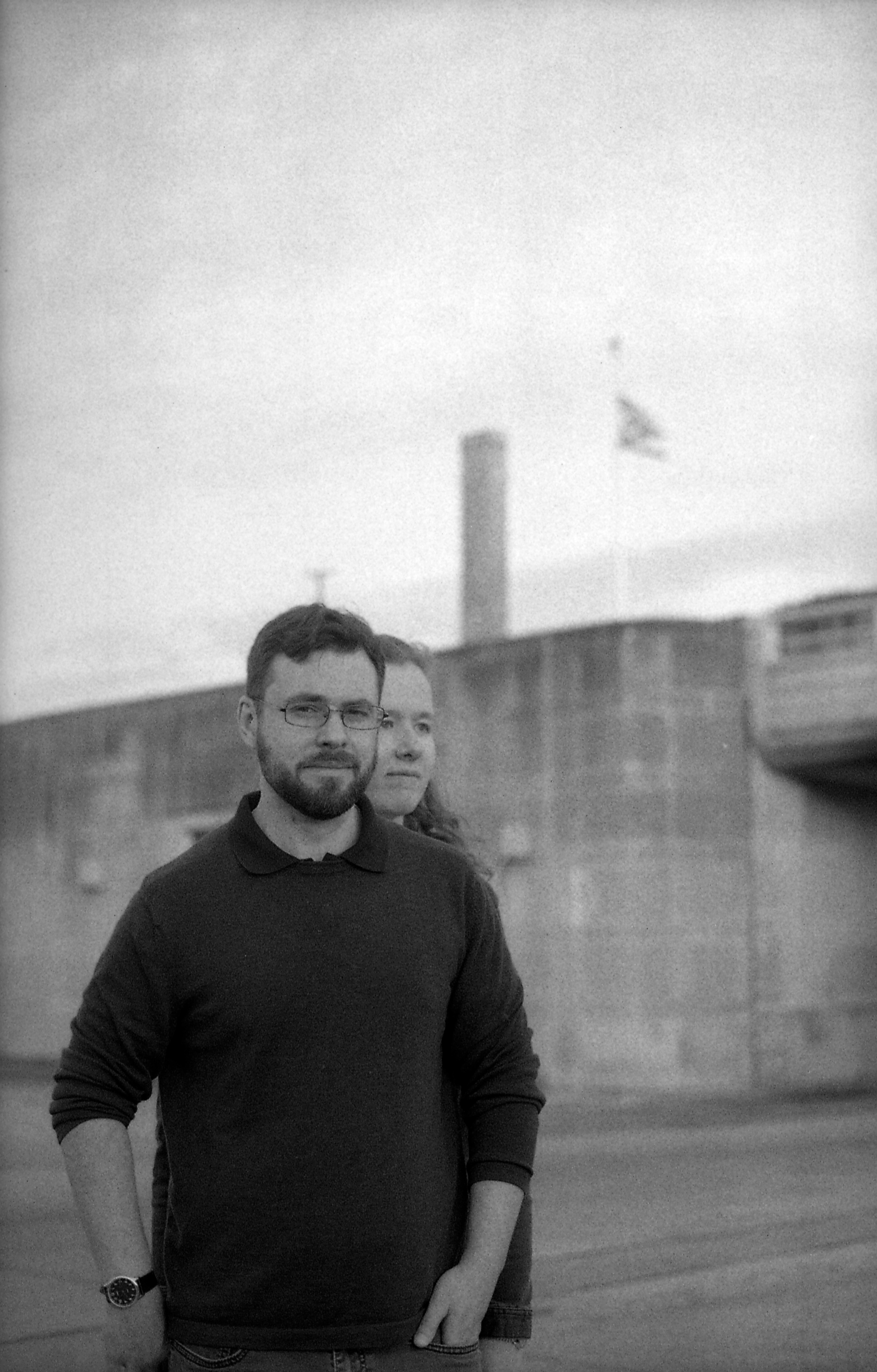 Couple posed in front of tunnel, black and white.